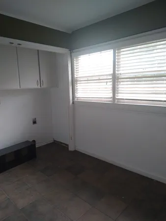 a view of backyard with tub and trees