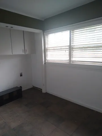 a view of backyard with tub and trees