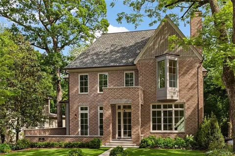 a view of a house with a yard and plants