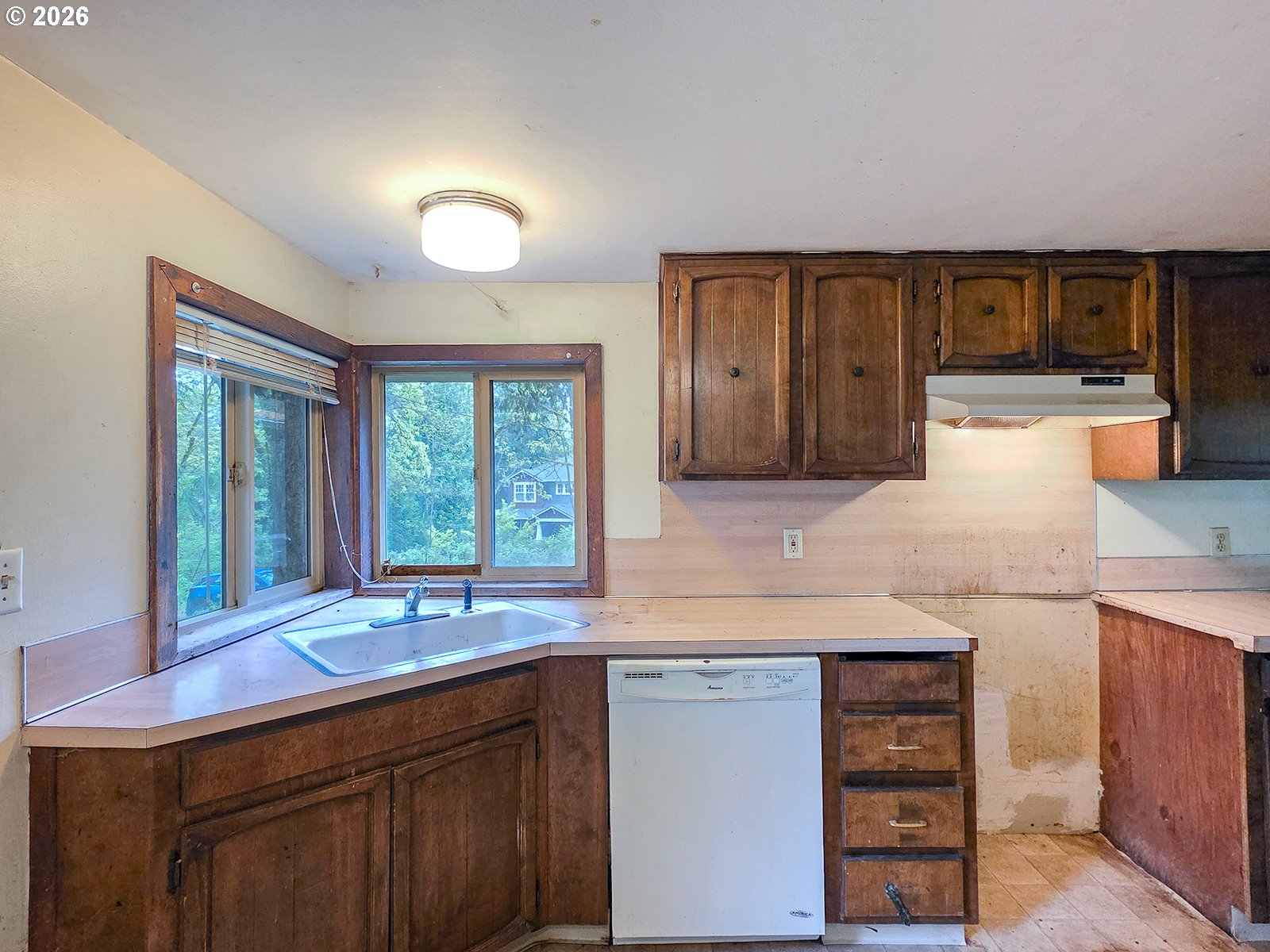 4410 Southeast Aldercrest Road Milwaukie, OR 97222 - Photo 11 of 28 a kitchen with granite countertop a sink and a stove