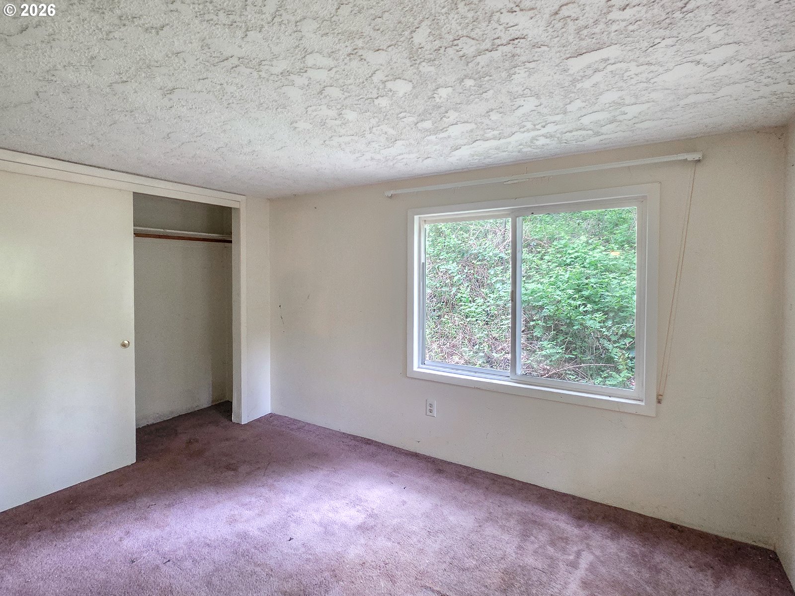 4410 Southeast Aldercrest Road Milwaukie, OR 97222 - Photo 12 of 28 an empty room with a window