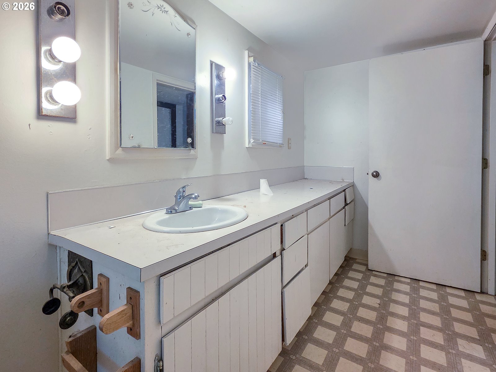 4410 Southeast Aldercrest Road Milwaukie, OR 97222 - Photo 17 of 28 a bathroom with a sink vanity and a mirror