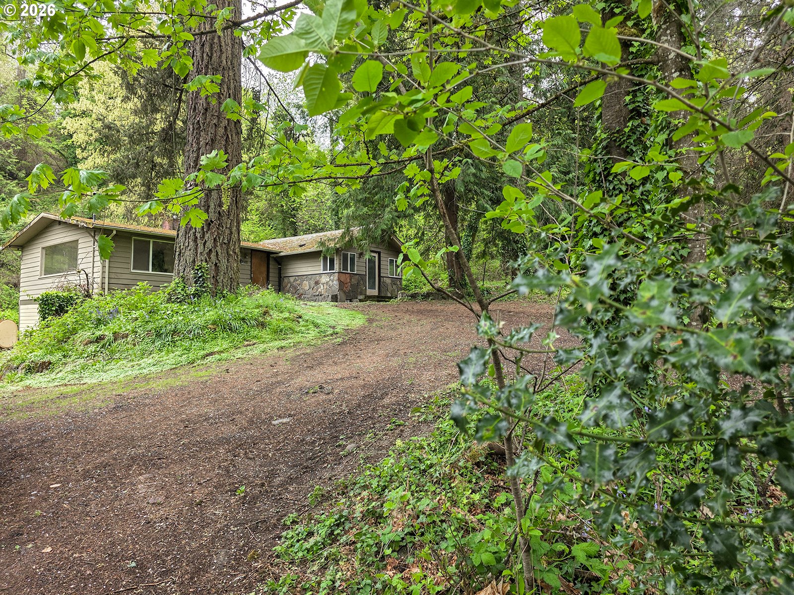 4410 Southeast Aldercrest Road Milwaukie, OR 97222 - Photo 2 of 28 a backyard of a house with seating space