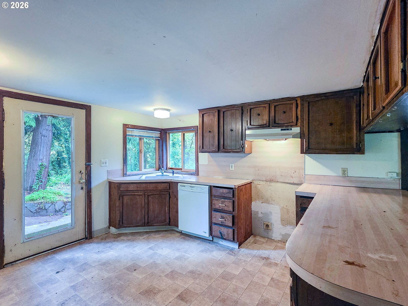 4410 Southeast Aldercrest Road Milwaukie, OR 97222 - Photo 10 of 28 a kitchen with sink and view of living room
