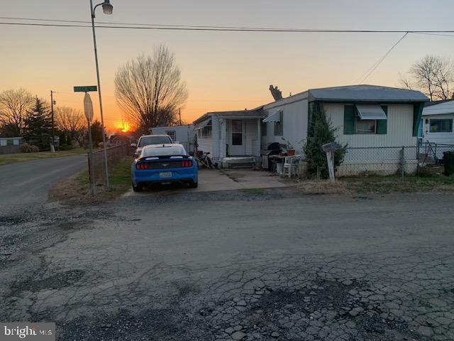 a view of a car park in front of a house