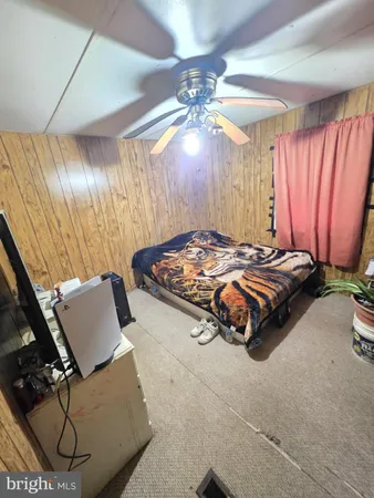 a bedroom with bed and window