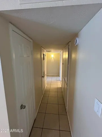 a bathroom with a mirror and a shower