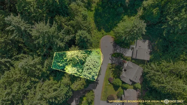 an aerial view of a house with a yard basket ball court and outdoor seating