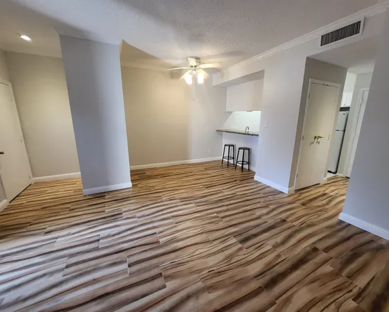 a view of a livingroom with wooden floor