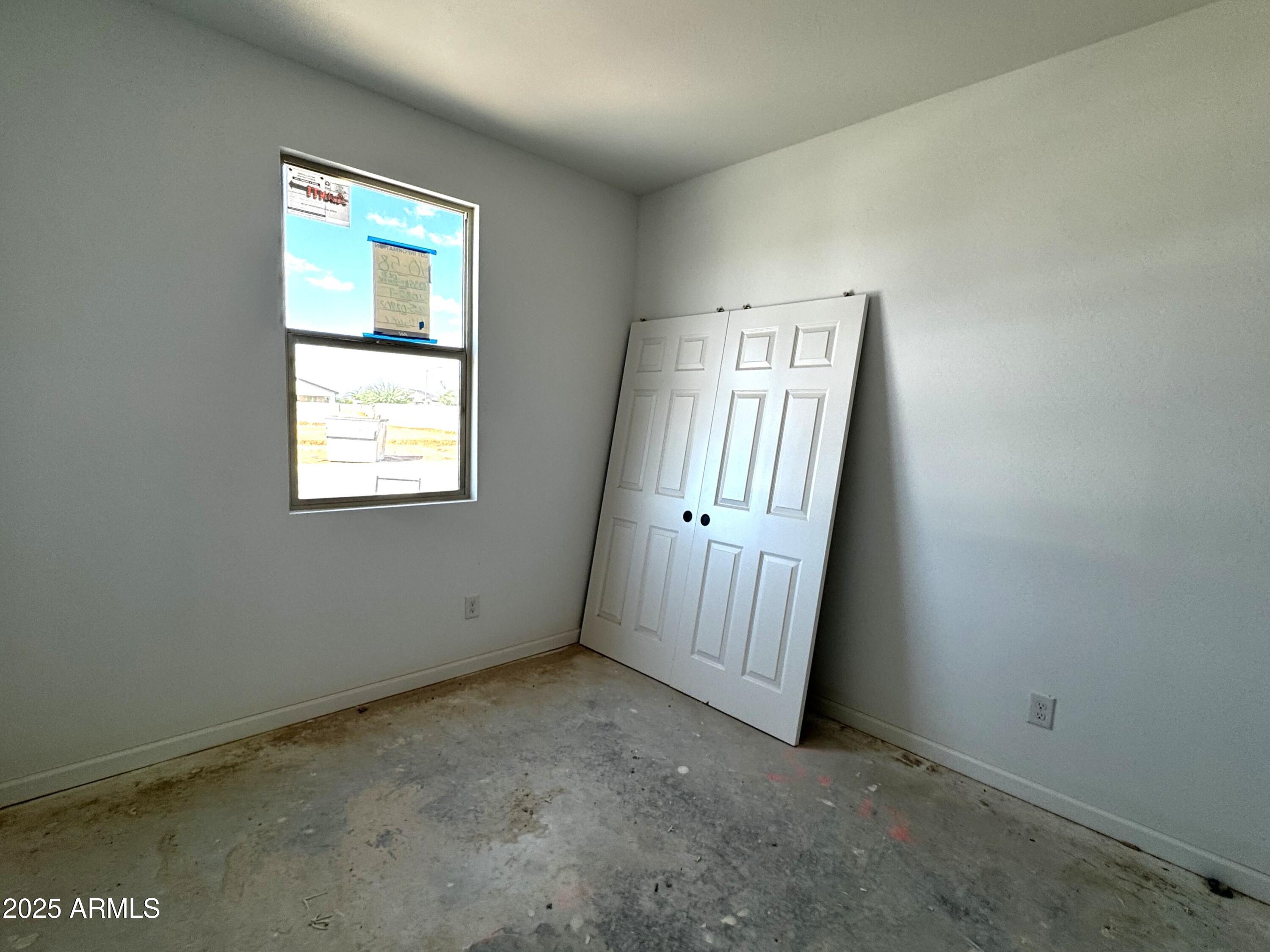46835 West Old Timer Road Maricopa, AZ 85139 - Photo 4 of 25 an empty room with windows