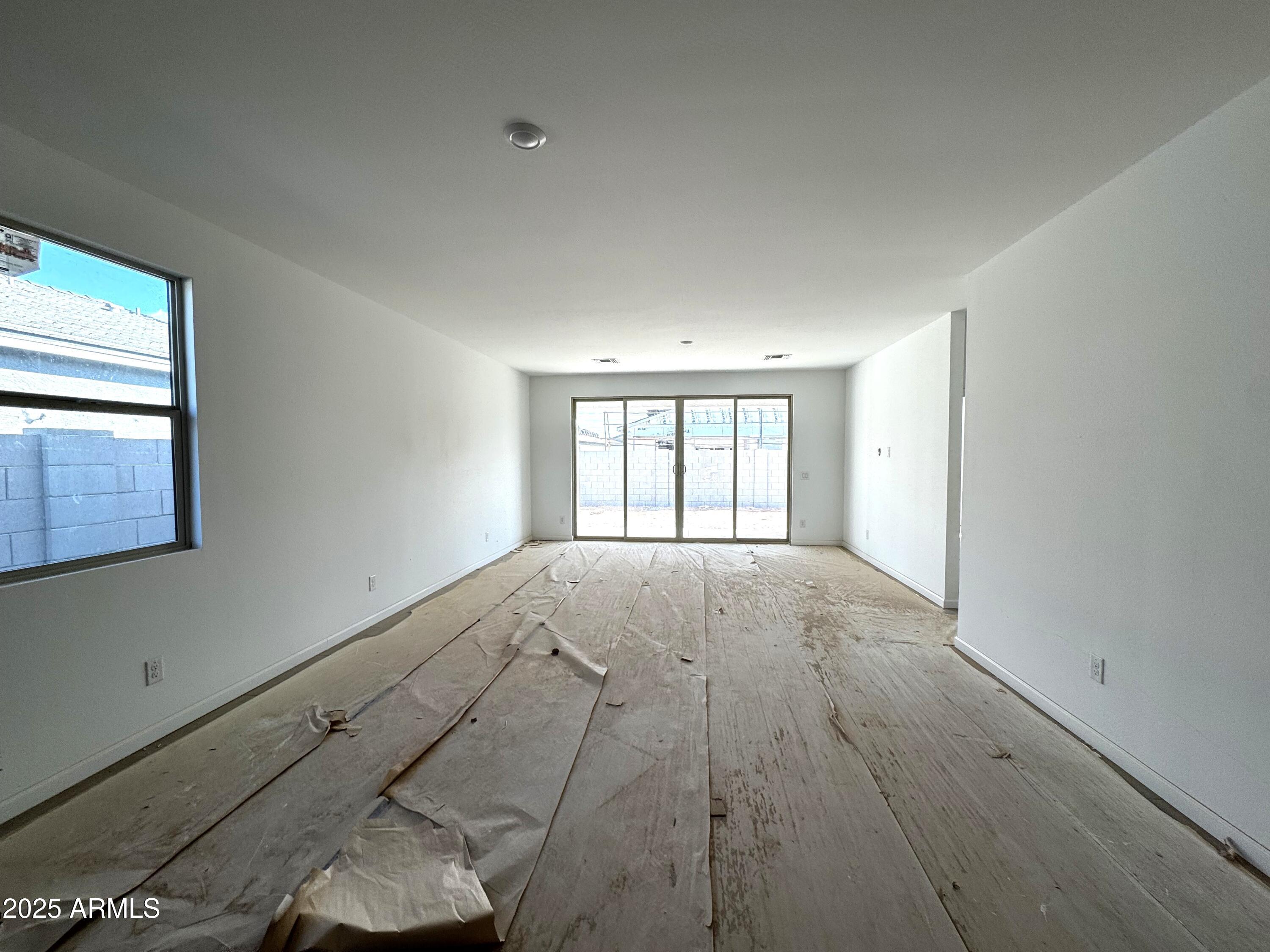 46835 West Old Timer Road Maricopa, AZ 85139 - Photo 8 of 25 a view of an empty room with a window