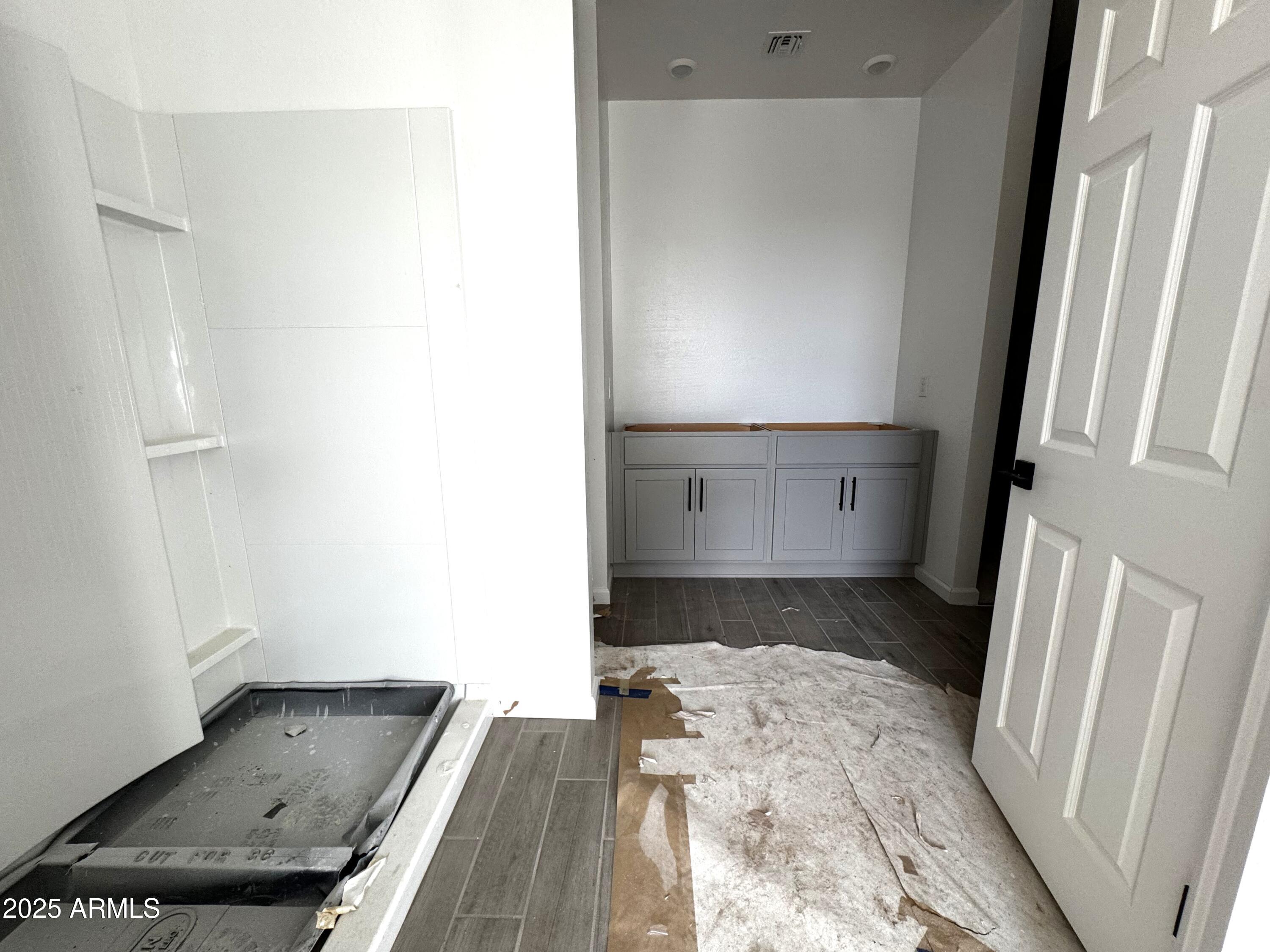 46835 West Old Timer Road Maricopa, AZ 85139 - Photo 10 of 25 a bathroom with a tub sink and vanity