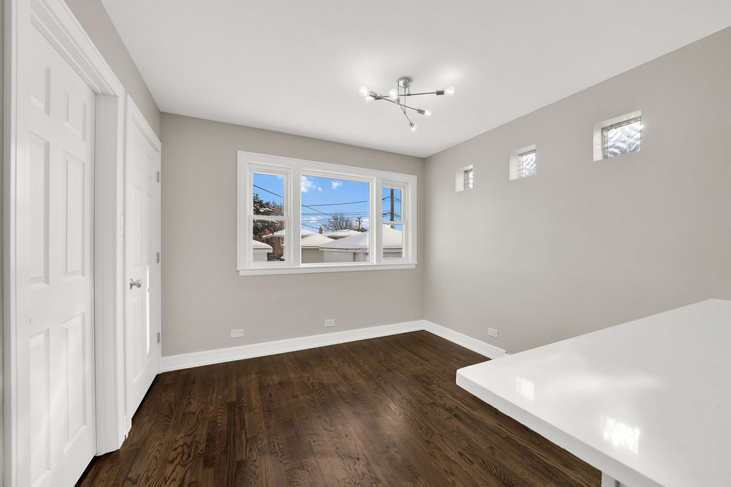 7725 South Albany Avenue Chicago, IL 60652 - Photo 11 of 25 a view of wooden floor and windows in a room