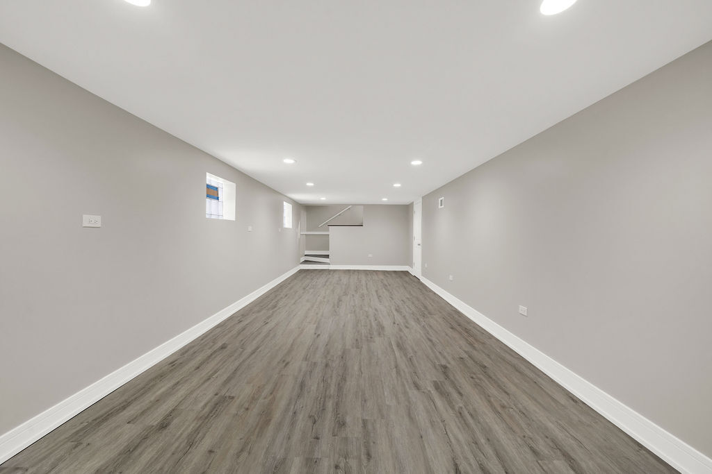 7725 South Albany Avenue Chicago, IL 60652 - Photo 22 of 25 a view of a room with wooden floor and window
