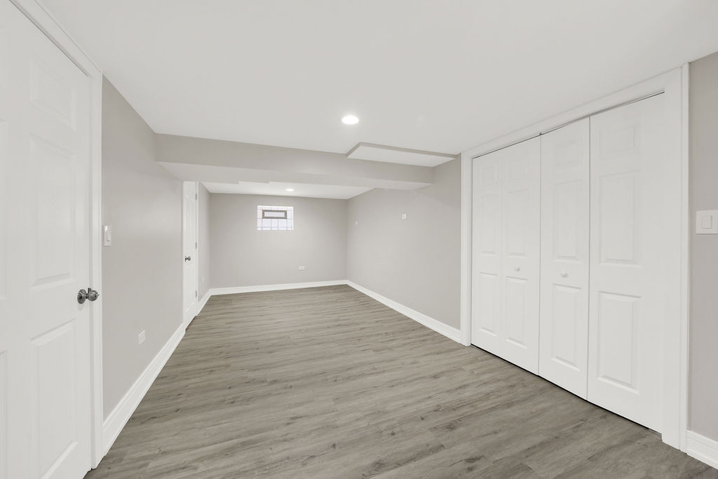 7725 South Albany Avenue Chicago, IL 60652 - Photo 23 of 25 a view of an empty room with wooden floor