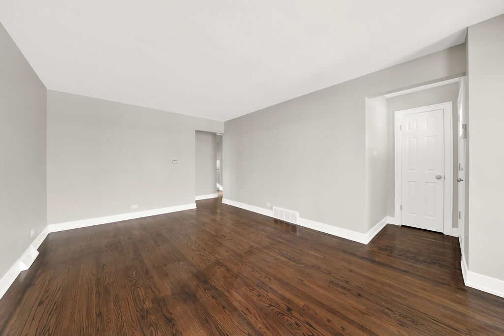 7725 South Albany Avenue Chicago, IL 60652 - Photo 6 of 25 a view of an empty room with wooden floor and closet