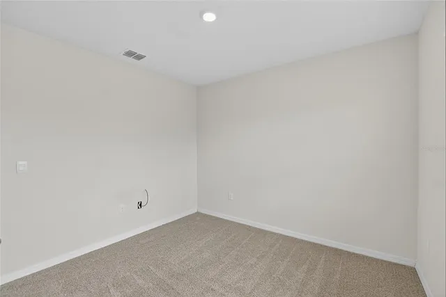 a view of a bathroom from a hallway