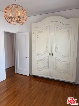 an empty room with wooden floor
