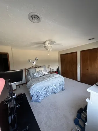 a kitchen with a refrigerator and a stove