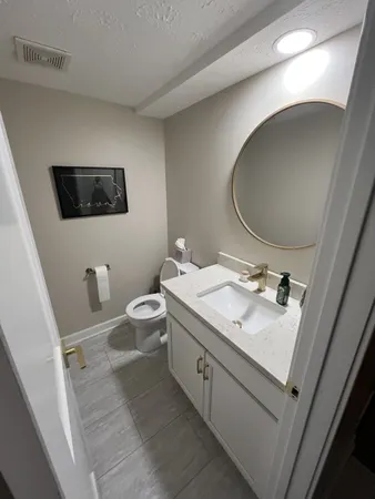a view of a dining room with furniture wooden floor and chandelier