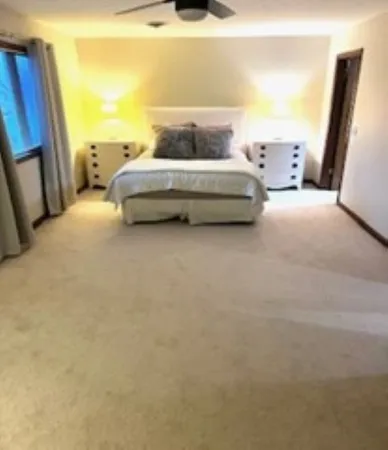 a bathroom with a double vanity sink and mirror