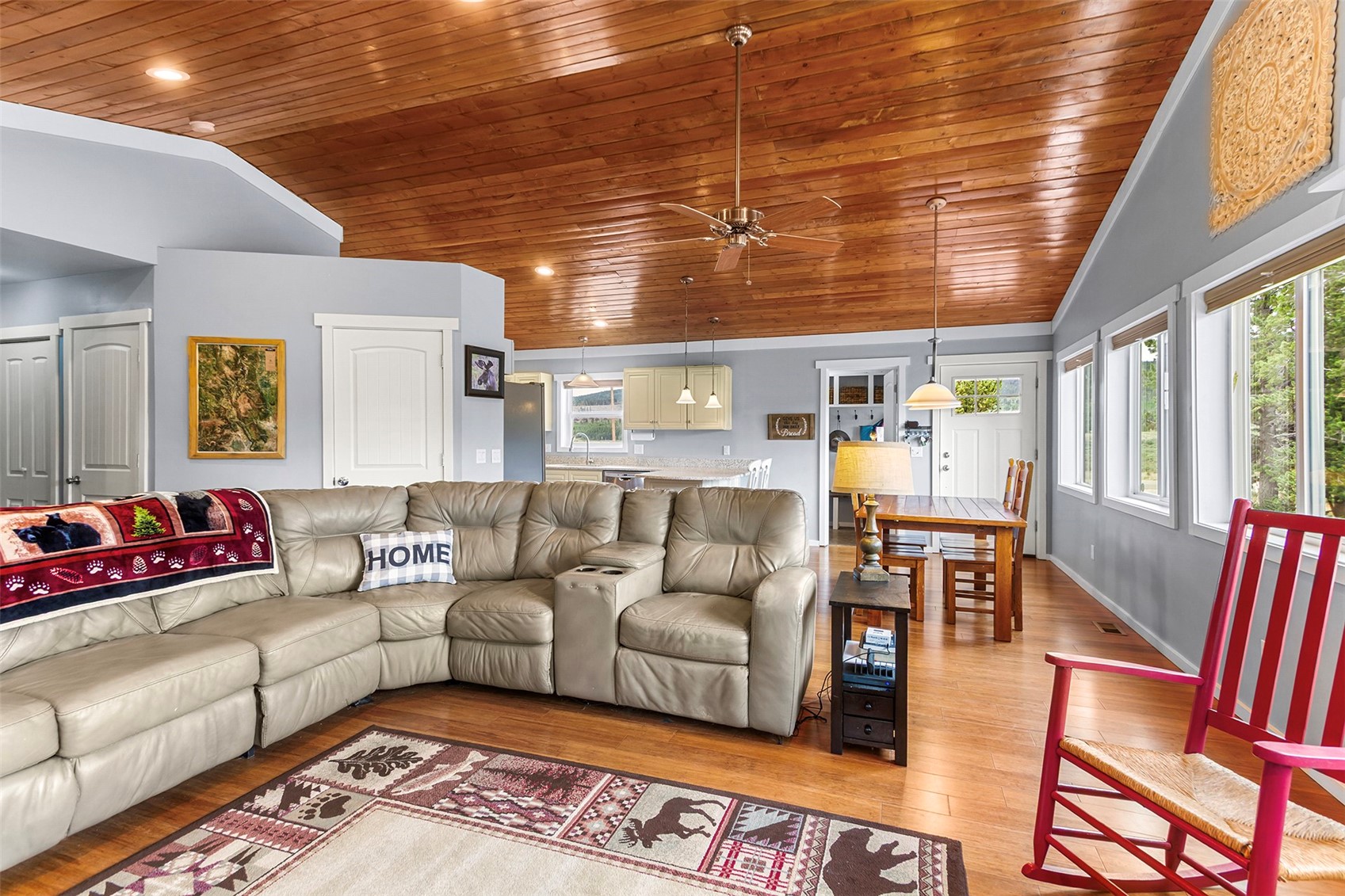 485 High Creek Road Fairplay, CO 80440 - Photo 6 of 32 Living area featuring wood ceiling, light wood-style floors, a ceiling fan, ornamental molding, and high vaulted ceiling