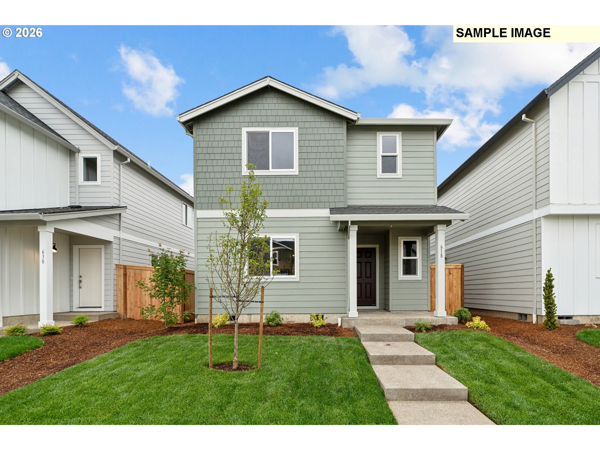 740 Merriott Lane Woodburn, OR 97071 - Photo 1 of 17 a front view of a house with a yard