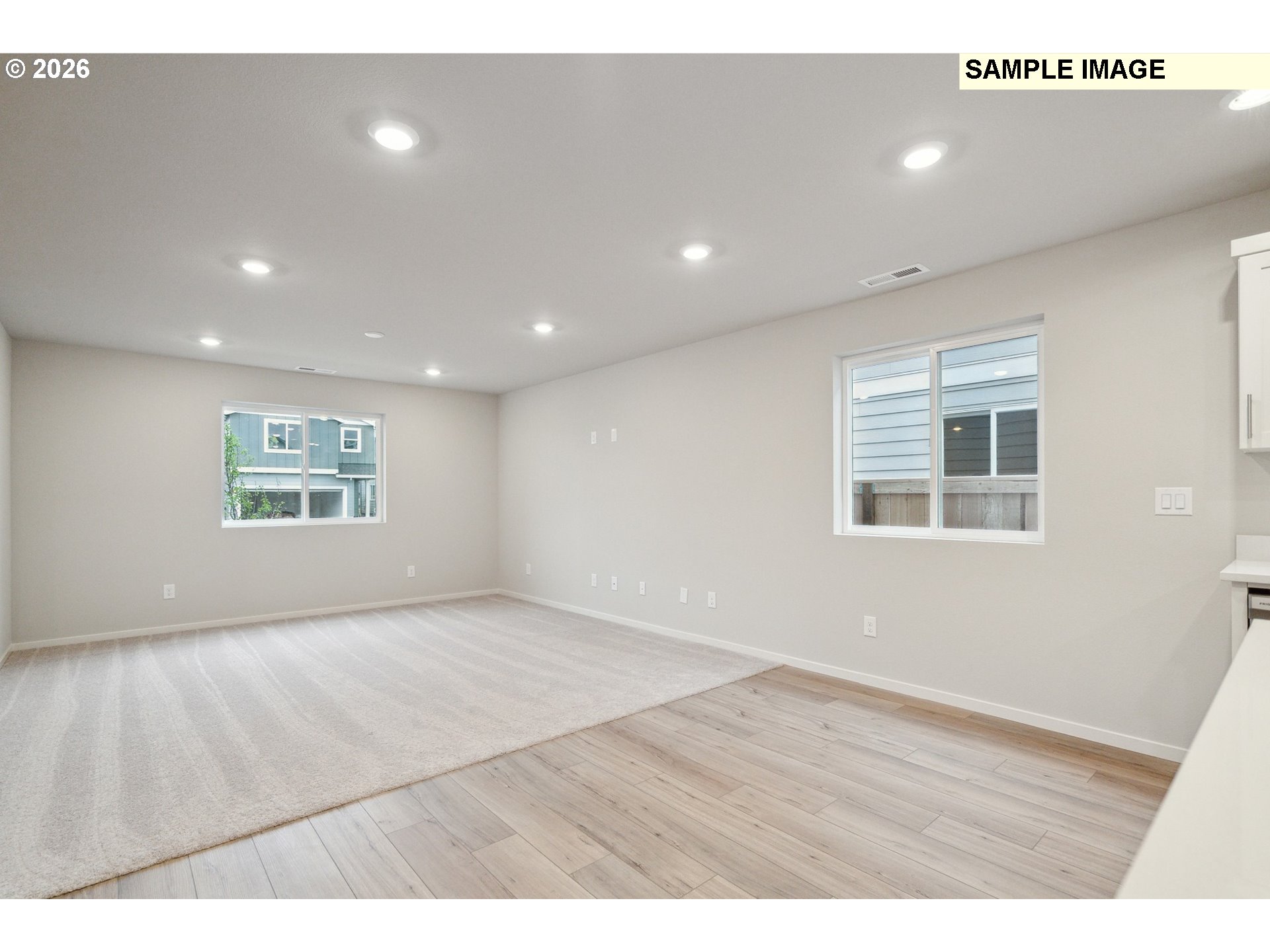 740 Merriott Lane Woodburn, OR 97071 - Photo 7 of 17 a view of an empty room with wooden floor and a window