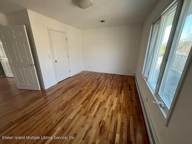 21 Alverson Loop Staten Island, NY 10309 - Photo 16 of 22 a view of balcony with wooden floor