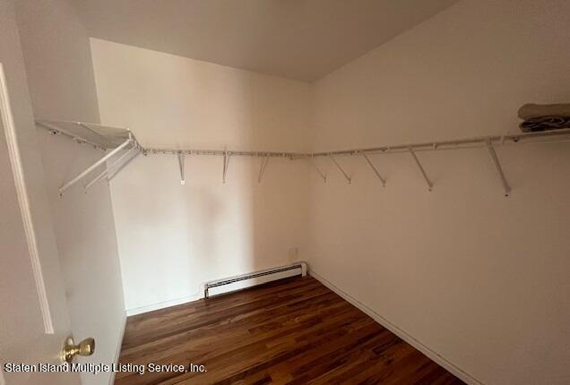 21 Alverson Loop Staten Island, NY 10309 - Photo 20 of 22 a view of a room with racks on the wall