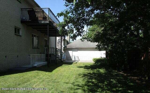21 Alverson Loop Staten Island, NY 10309 - Photo 22 of 22 a view of a house with a small yard