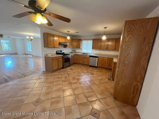 21 Alverson Loop Staten Island, NY 10309 - Photo 4 of 22 a kitchen with a sink a stove cabinets and counter space