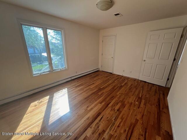 21 Alverson Loop Staten Island, NY 10309 - Photo 5 of 22 a view of an empty room and window