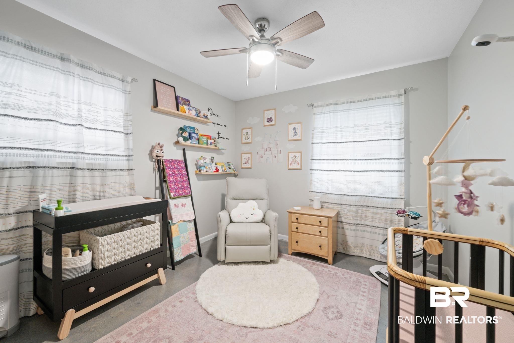 621 Ann Street Saraland, AL 36571 - Photo 11 of 21 Bedroom with concrete floors, a nursery area, and ceiling fan