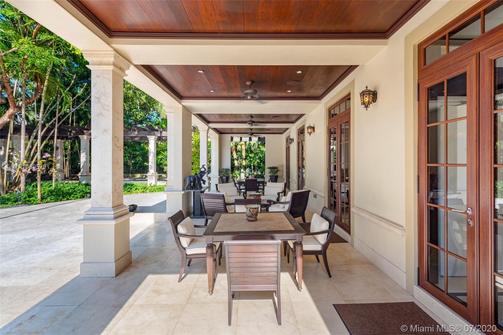 4800 Pine Drive Miami, FL 33143 - Photo 11 of 58 a dining room with balcony