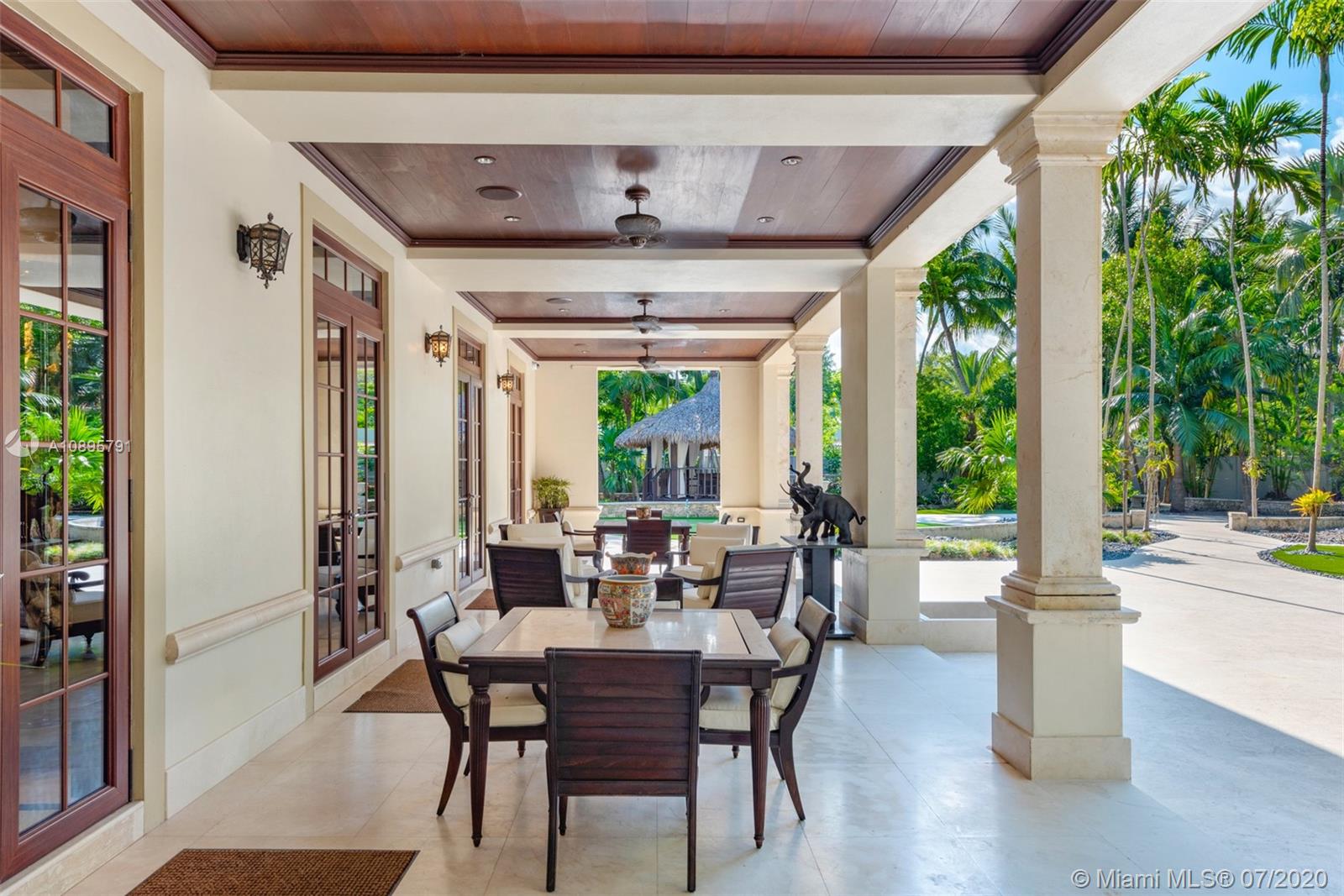 4800 Pine Drive Miami, FL 33143 - Photo 12 of 58 a view of a dining room with furniture window and outside view