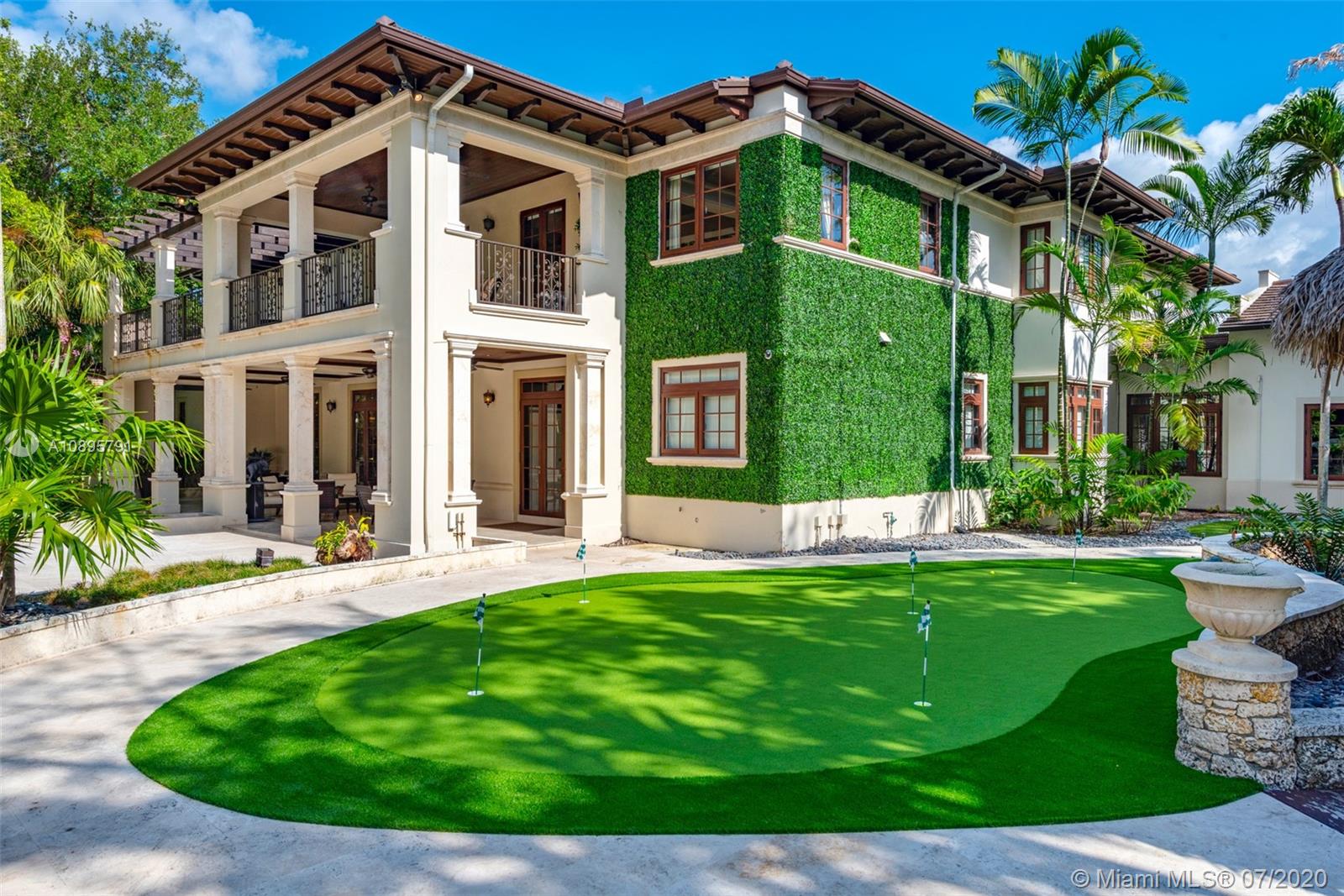 4800 Pine Drive Miami, FL 33143 - Photo 13 of 58 front view of a house with a yard