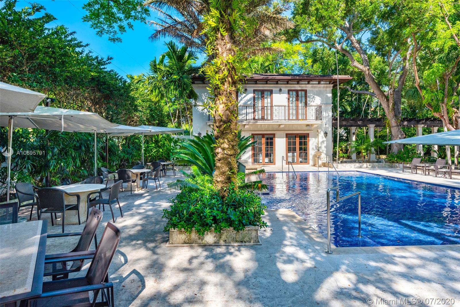 4800 Pine Drive Miami, FL 33143 - Photo 15 of 58 a view of a house with backyard sitting area and garden