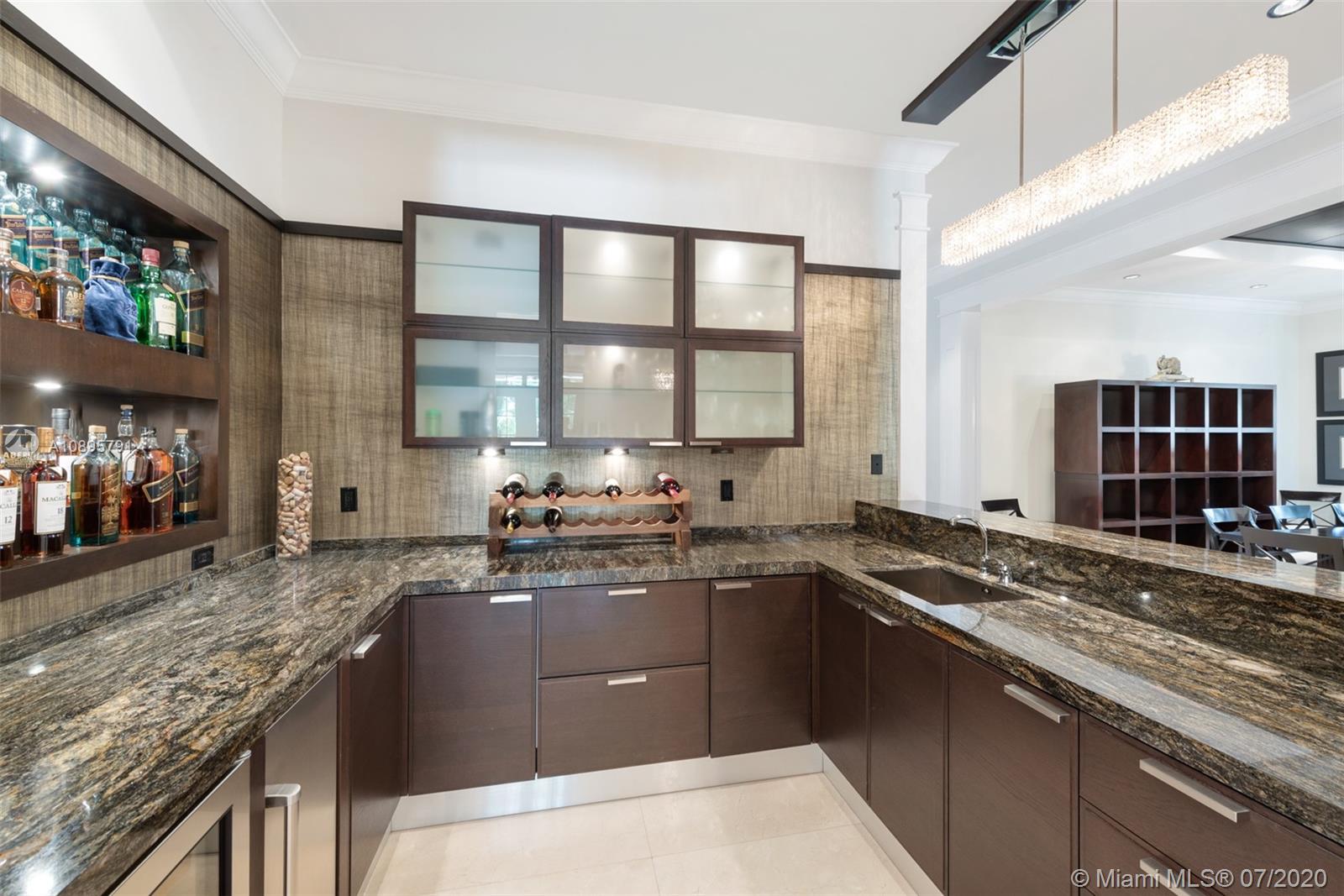 4800 Pine Drive Miami, FL 33143 - Photo 22 of 58 a kitchen with stainless steel appliances granite countertop a sink stove and cabinets