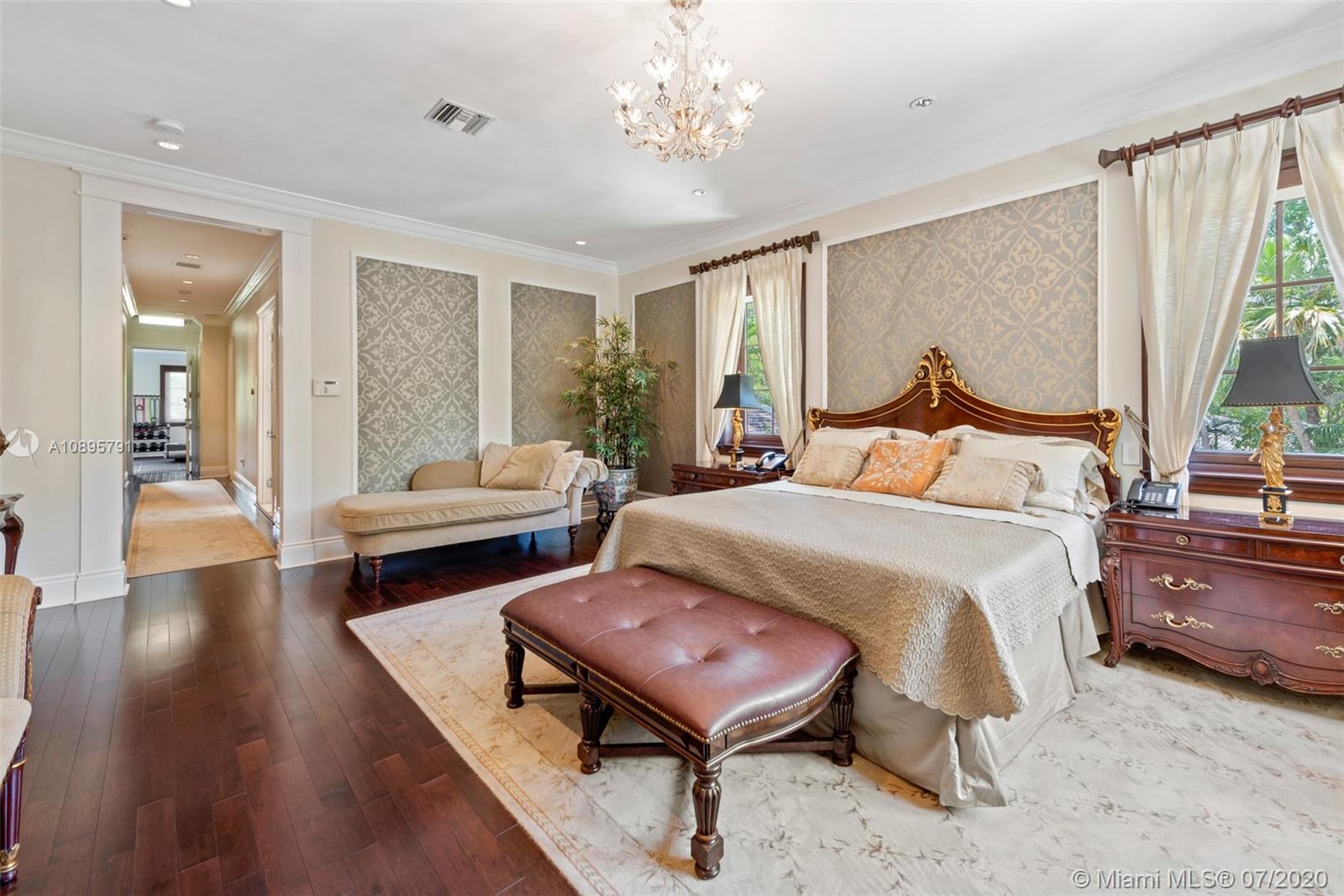 4800 Pine Drive Miami, FL 33143 - Photo 28 of 58 a bedroom with a bed and wooden floor