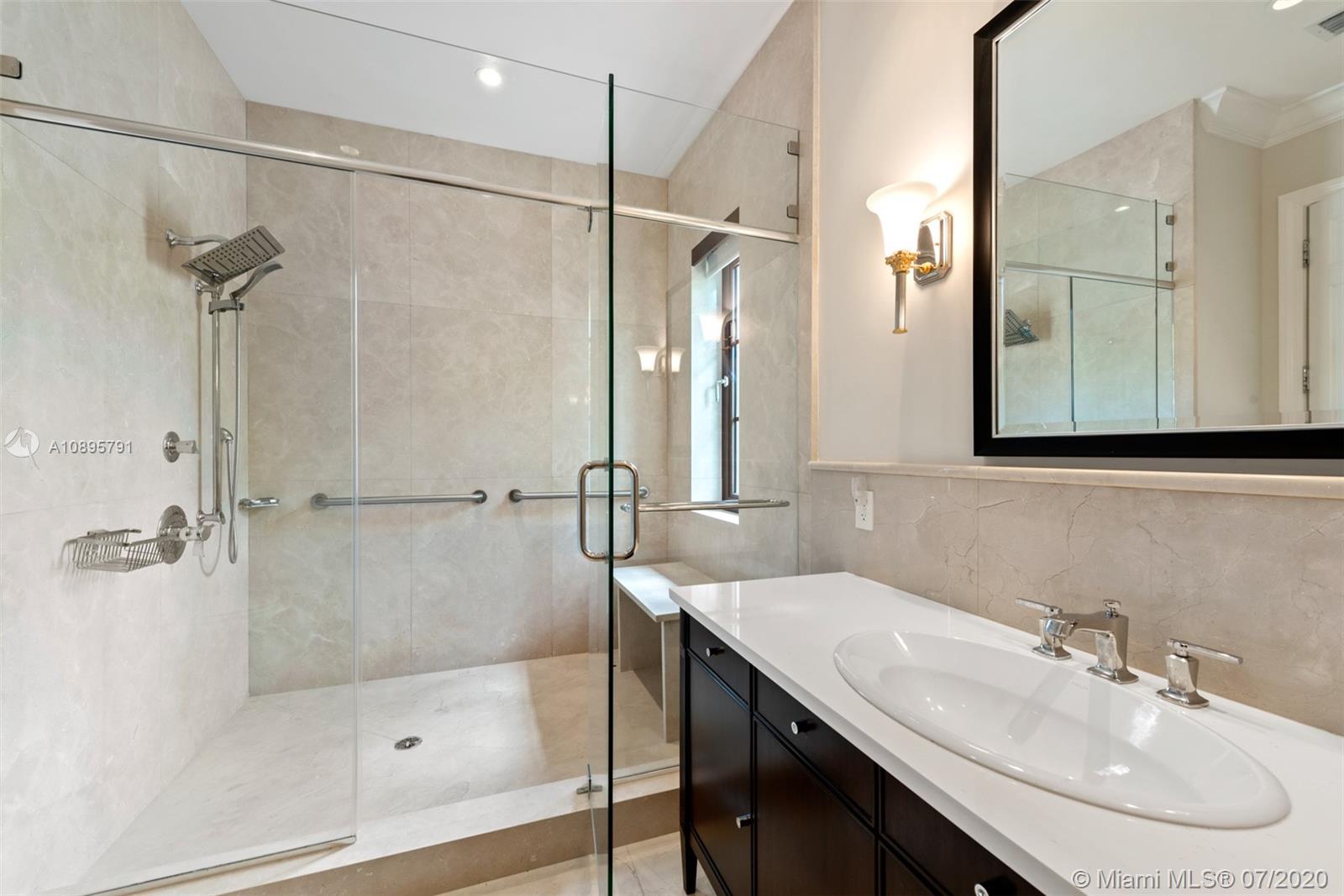 4800 Pine Drive Miami, FL 33143 - Photo 37 of 58 a bathroom with a sink shower and a mirror