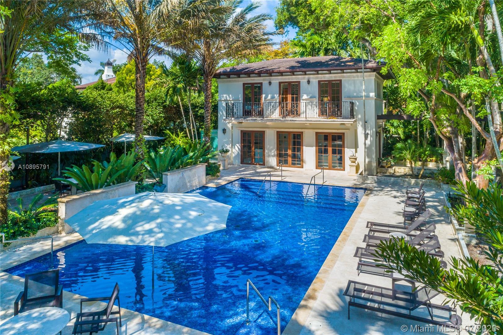 4800 Pine Drive Miami, FL 33143 - Photo 42 of 58 a front view of a house with yard