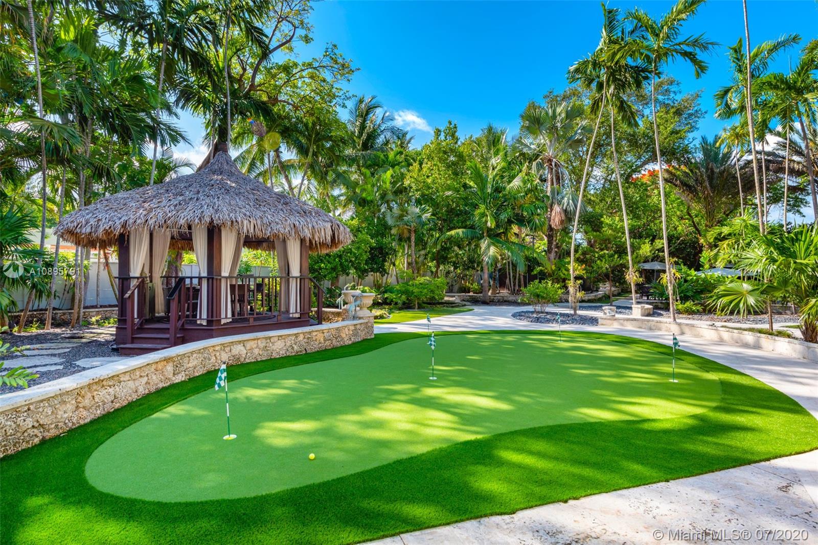 4800 Pine Drive Miami, FL 33143 - Photo 46 of 58 a view of a house with a swimming pool and sitting area
