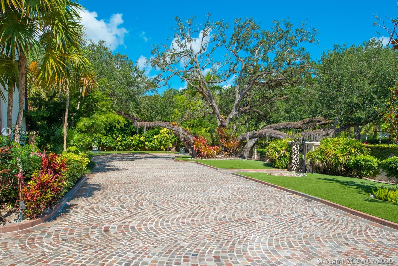 4800 Pine Drive Miami, FL 33143 - Photo 56 of 58 a view of a garden with a flower in a garden
