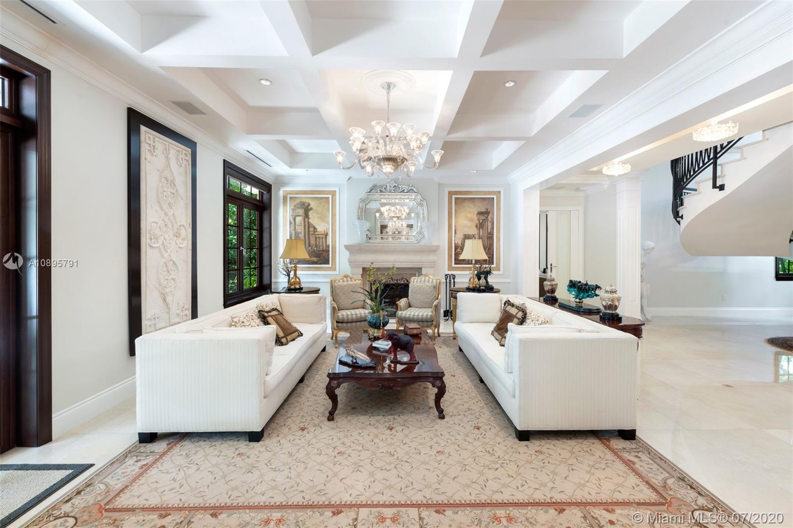 4800 Pine Drive Miami, FL 33143 - Photo 8 of 58 a living room with furniture and a chandelier