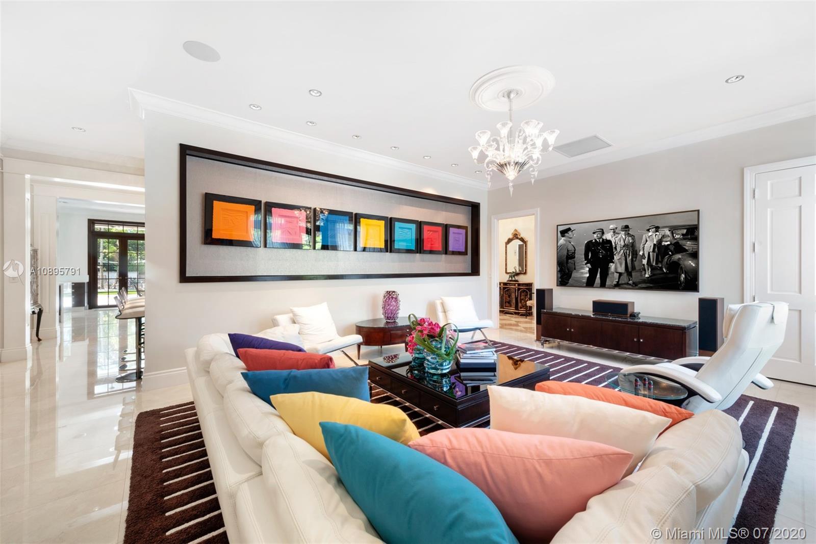 4800 Pine Drive Miami, FL 33143 - Photo 9 of 58 a living room with furniture a flat screen tv and a wall painting