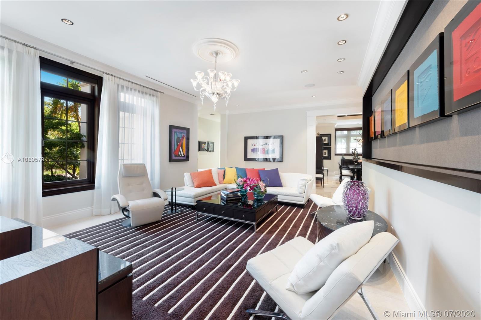 4800 Pine Drive Miami, FL 33143 - Photo 10 of 58 a living room with furniture and a chandelier