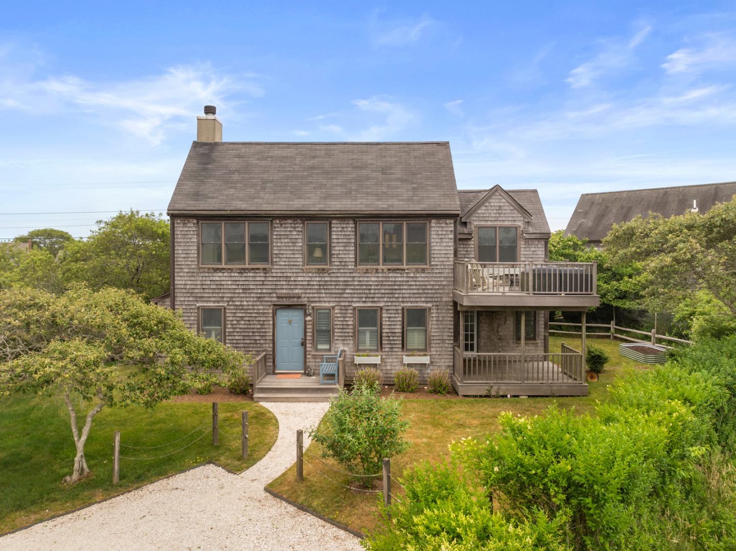 4 Berkley Street Nantucket, MA 02554 - Photo 8 of 47 a front view of a house with a yard
