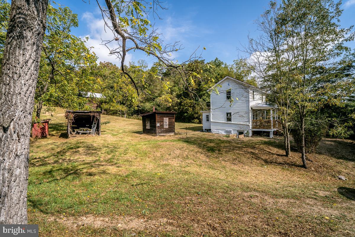 4771 Mill Creek Road Mount Jackson, VA 22842 - Photo 17 of 29 a view of a house with a yard