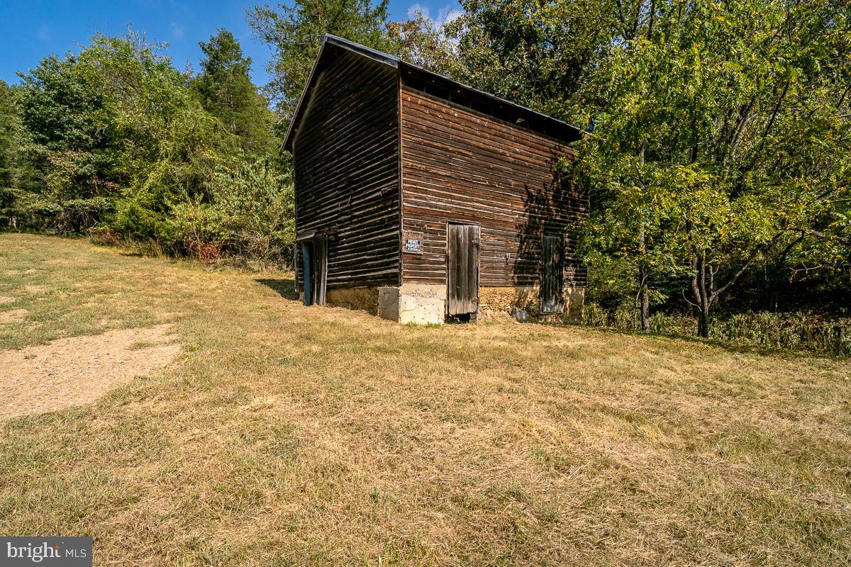 4771 Mill Creek Road Mount Jackson, VA 22842 - Photo 24 of 29 a view of house with backyard and trees